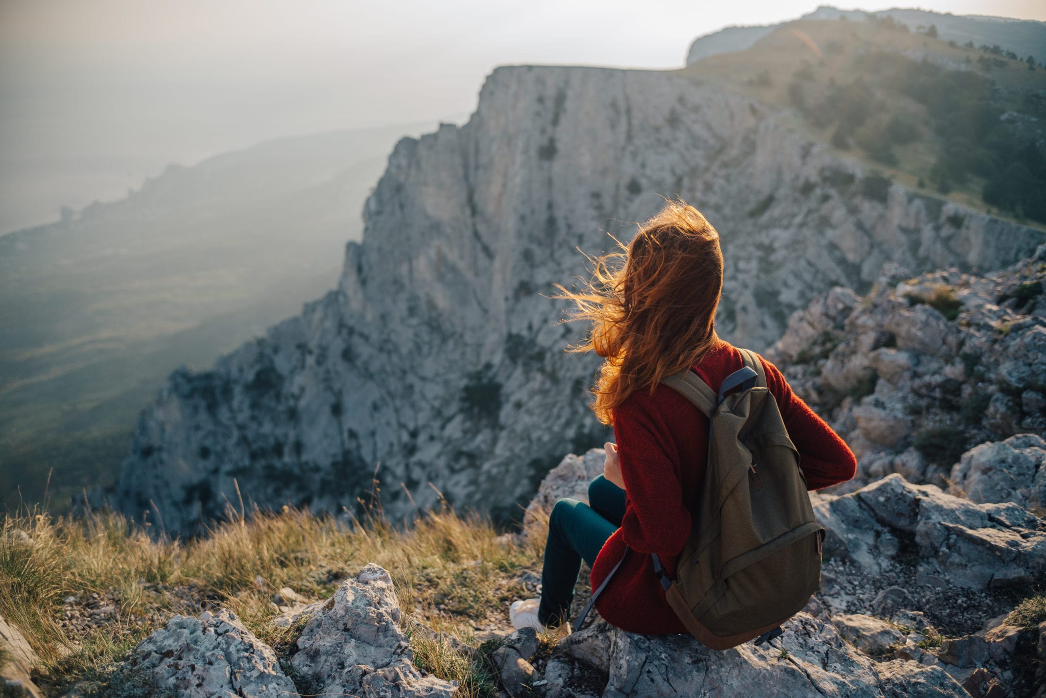 Reading in the mountains. Travel blogging. Girl reading in the Mountains. The Journey begins girl in the Mountains.