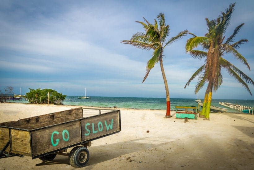 A wooden cart shares the Caye Caulker slogan: Go Slow | © Diego Grandi