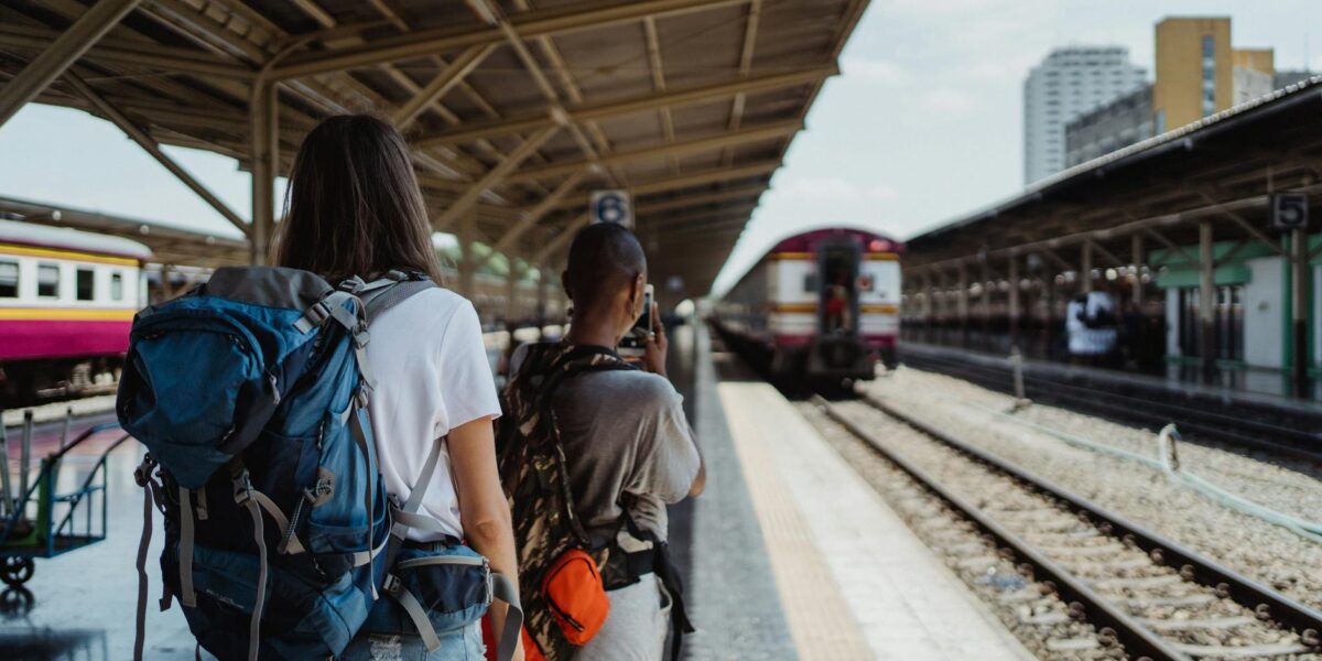 backpackers on railway station