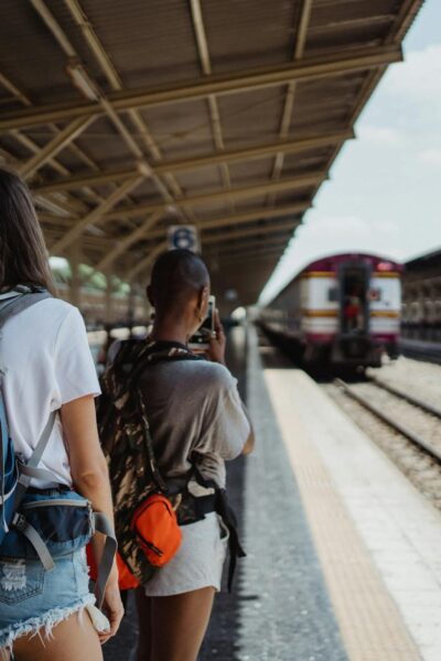 backpackers on railway station