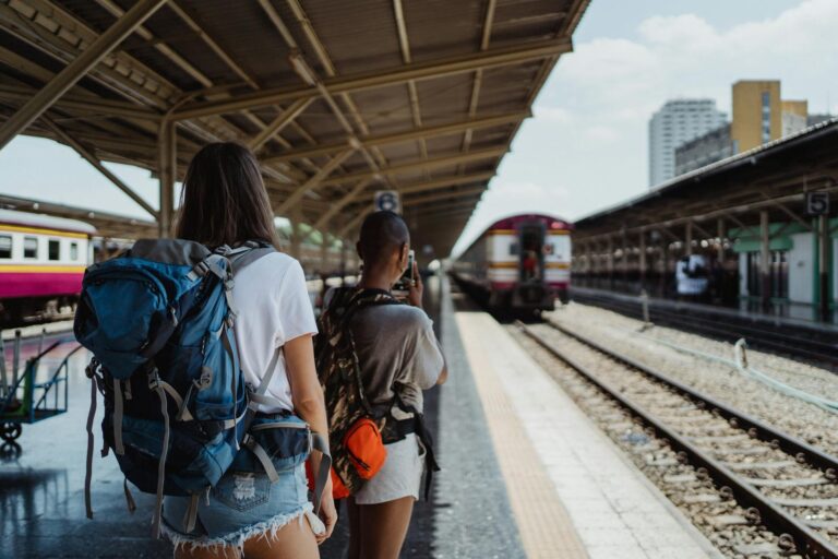 backpackers on railway station