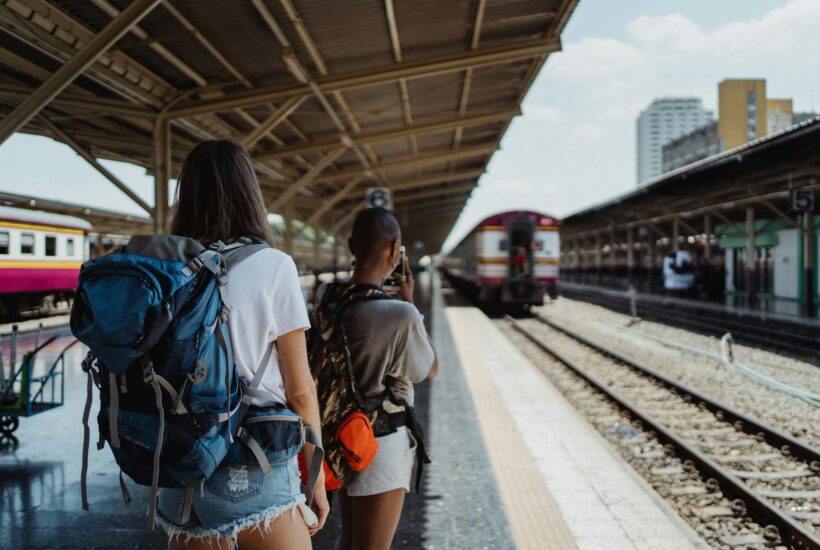 backpackers on railway station